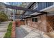 Brick patio with pergola cover, offering a shaded outdoor space at 3894 Foxford Dr, Atlanta, GA 30340