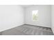 Simple bedroom with gray carpet and a window at 412 Newland Way, Acworth, GA 30102