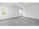 Spacious bedroom with grey carpet and large windows at 412 Newland Way, Acworth, GA 30102