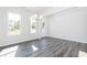 Sunlit dining room with hardwood floors and chandelier at 412 Newland Way, Acworth, GA 30102