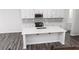 Kitchen island with white quartz countertop and stainless steel sink at 412 Newland Way, Acworth, GA 30102