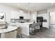 Modern kitchen with white cabinets, island, and stainless steel appliances at 412 Newland Way, Acworth, GA 30102