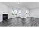 Spacious living room featuring a fireplace and plenty of natural light at 412 Newland Way, Acworth, GA 30102