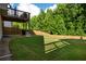 Large backyard with wooden fence and elevated deck at 4568 Mantova Dr, Buford, GA 30519