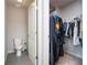 Small bathroom with toilet and access to a closet at 4568 Mantova Dr, Buford, GA 30519