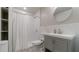 Basement bathroom with shower/tub combo and gray vanity at 4568 Mantova Dr, Buford, GA 30519