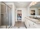 Double vanity bathroom with walk-in shower and linen closet at 4568 Mantova Dr, Buford, GA 30519