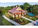 Community clubhouse with pool and landscaping at 4568 Mantova Dr, Buford, GA 30519