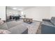 Basement recreation room with sectional sofa, coffee table, and pool table at 1495 Gabriel Dr, Lawrenceville, GA 30043