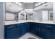 Elegant bathroom with a double vanity and blue cabinets at 1495 Gabriel Dr, Lawrenceville, GA 30043