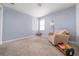 Light and airy bedroom with a neutral color palette at 1495 Gabriel Dr, Lawrenceville, GA 30043
