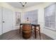 Bright breakfast nook features a charming barrel table and two stools at 1495 Gabriel Dr, Lawrenceville, GA 30043