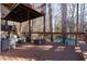 Deck with seating area and wooded backdrop at 1495 Gabriel Dr, Lawrenceville, GA 30043