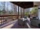 Relaxing deck with seating area, overlooking wooded backyard at 1495 Gabriel Dr, Lawrenceville, GA 30043