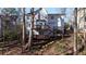Two story house with large deck, stairs leading to backyard at 1495 Gabriel Dr, Lawrenceville, GA 30043