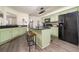 Modern kitchen featuring green cabinets and granite countertops at 1495 Gabriel Dr, Lawrenceville, GA 30043