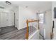 View of a bright stairwell with light gray flooring and white walls at 1495 Gabriel Dr, Lawrenceville, GA 30043