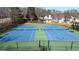 Two well-maintained tennis courts in community at 1495 Gabriel Dr, Lawrenceville, GA 30043