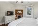 Bedroom with fireplace and built-in shelving at 407 Bass Se St, Atlanta, GA 30315