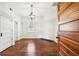 Cozy bedroom featuring hardwood floors, white walls, and a decorative light fixture at 407 Bass Se St, Atlanta, GA 30315