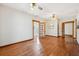 Spacious living room featuring beautiful hardwood floors, vintage ceiling fans, and detailed trim at 407 Bass Se St, Atlanta, GA 30315