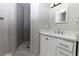 Modern bathroom with white vanity, quartz countertop, and walk-in shower at 1036 Greenwood Ne Ave # C, Atlanta, GA 30306