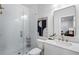 Modern bathroom featuring a glass enclosed shower, floating vanity, and attractive gold fixtures at 124 Everley Walk, Alpharetta, GA 30009
