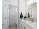 Bright bathroom featuring a single sink vanity, gold fixtures, and shower-tub combo at 124 Everley Walk, Alpharetta, GA 30009