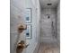 Tiled shower with rainfall showerhead and built-in bench, and brass fixtures at 124 Everley Walk, Alpharetta, GA 30009