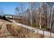 A paved path winds through a wooded area, offering scenic walking trails at 124 Everley Walk, Alpharetta, GA 30009