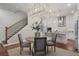 Elegant dining room with a round table and chairs, adjacent to kitchen at 124 Everley Walk, Alpharetta, GA 30009
