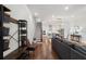 Bright entryway with bench, shoe storage, and open view to living area and kitchen at 124 Everley Walk, Alpharetta, GA 30009