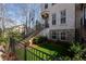 Townhouse with elevated front yard, decorative fence, and easy access steps at 124 Everley Walk, Alpharetta, GA 30009