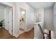 Bright hallway with hardwood floors and access to bedrooms and bathroom at 124 Everley Walk, Alpharetta, GA 30009