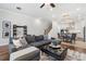 Open concept living room with sectional sofa, fireplace, and hardwood floors at 124 Everley Walk, Alpharetta, GA 30009