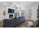 Spacious living room with sectional sofa, fireplace and hardwood floors at 124 Everley Walk, Alpharetta, GA 30009