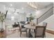 Open living and dining area with hardwood floors, fireplace, and access to backyard at 124 Everley Walk, Alpharetta, GA 30009