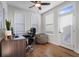 Comfortable office featuring wood floors, a ceiling fan, and lots of natural light from the door at 124 Everley Walk, Alpharetta, GA 30009
