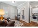 Home office with hardwood floors, built-in desk, and laundry access at 124 Everley Walk, Alpharetta, GA 30009