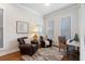 Cozy home office with ample natural light, comfortable seating, and a dedicated workspace at 124 Everley Walk, Alpharetta, GA 30009