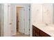 Double vanity bathroom with tile shower and walk-in closet at 5482 Fountainhead Ln, Auburn, GA 30011