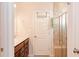Bathroom with double vanity, tile shower, and linen closet at 5482 Fountainhead Ln, Auburn, GA 30011