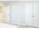 Bedroom with double doors and a white metal bed frame at 5482 Fountainhead Ln, Auburn, GA 30011