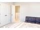 Bedroom with double doors and a gray couch at 5482 Fountainhead Ln, Auburn, GA 30011