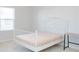 Bedroom with a white metal bed frame and small desk at 5482 Fountainhead Ln, Auburn, GA 30011