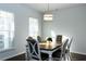 Bright dining room with a wood table and gray chairs at 5482 Fountainhead Ln, Auburn, GA 30011