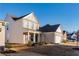 Side view of two story house with white siding and brick accents at 5482 Fountainhead Ln, Auburn, GA 30011
