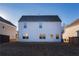 Two-story house with white siding and backyard at 5482 Fountainhead Ln, Auburn, GA 30011
