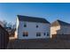Two-story house with white siding, backyard, and wooden fence at 5482 Fountainhead Ln, Auburn, GA 30011
