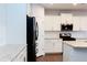 Modern kitchen with stainless steel appliances and granite countertops at 5482 Fountainhead Ln, Auburn, GA 30011